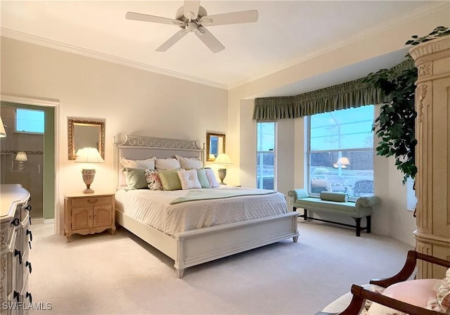 carpeted bedroom featuring ornamental molding and ceiling fan