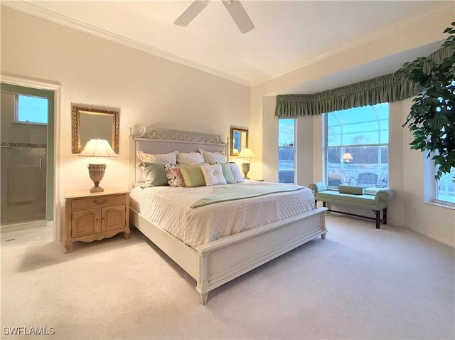 bedroom with crown molding, lofted ceiling, light colored carpet, and ceiling fan