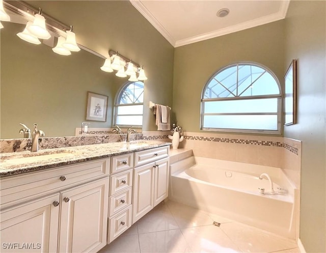 bathroom featuring tile patterned flooring, vanity, a bathtub, and ornamental molding