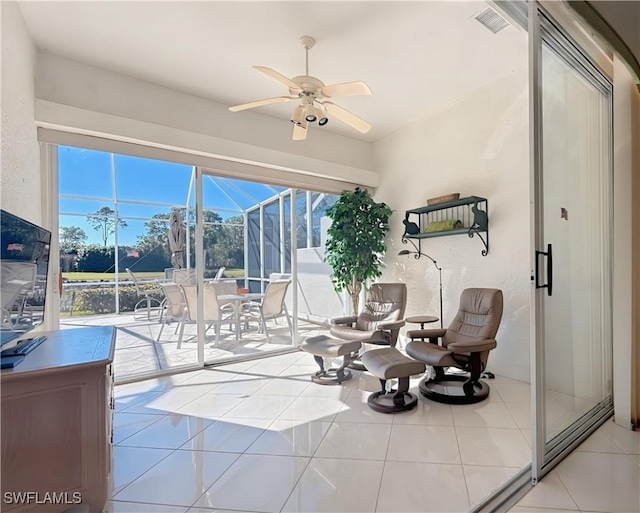 interior space with ceiling fan