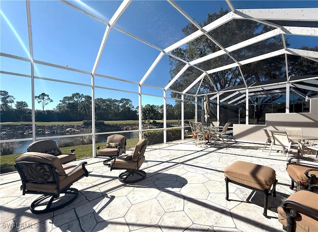 view of patio / terrace featuring glass enclosure