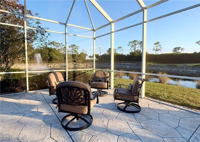 sunroom / solarium with a water view