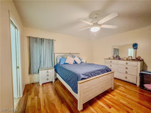 bedroom featuring ceiling fan and wood-type flooring