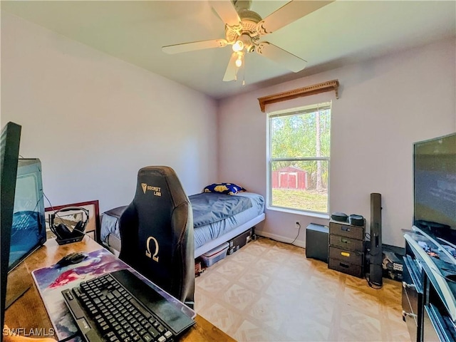 bedroom with multiple windows and ceiling fan