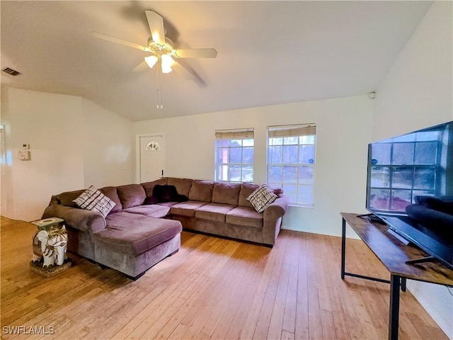 living room with ceiling fan and light hardwood / wood-style floors