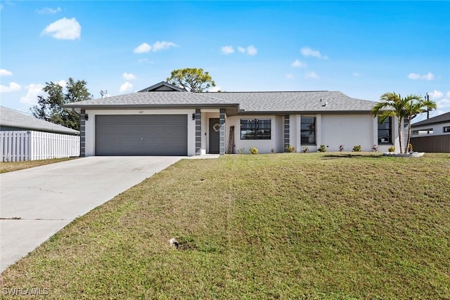 ranch-style home with a garage and a front lawn