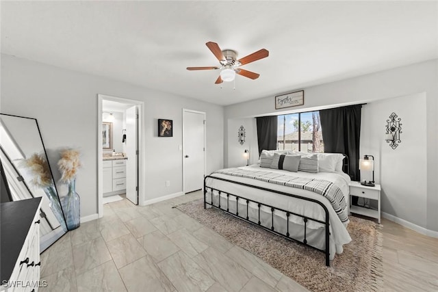 bedroom featuring ensuite bathroom and ceiling fan