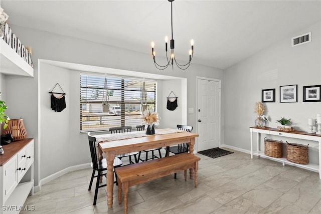 dining space featuring a chandelier