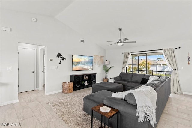 living room featuring ceiling fan and high vaulted ceiling