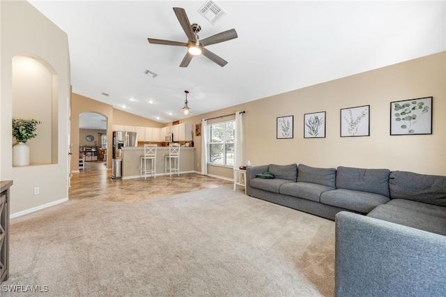 13404 Bristol Park Way, Fort Myers, FL 33913 - living area with lofted ceiling, arched walkways, a ceiling fan, and light colored carpet