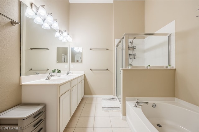 bathroom with vanity, shower with separate bathtub, and tile patterned flooring