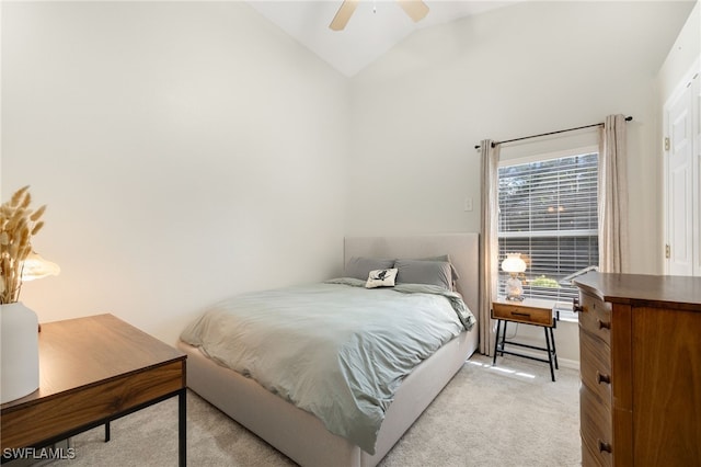 bedroom with ceiling fan, light colored carpet, and lofted ceiling