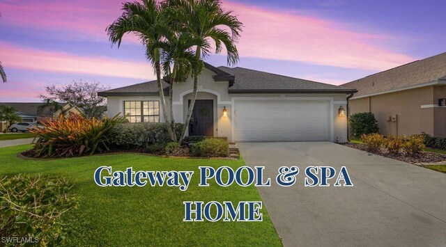 13404 Bristol Park Way, Fort Myers, FL 33913 - ranch-style home featuring concrete driveway, an attached garage, stucco siding, and a lawn