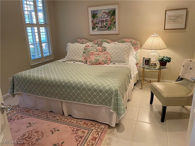 bedroom featuring light tile patterned floors