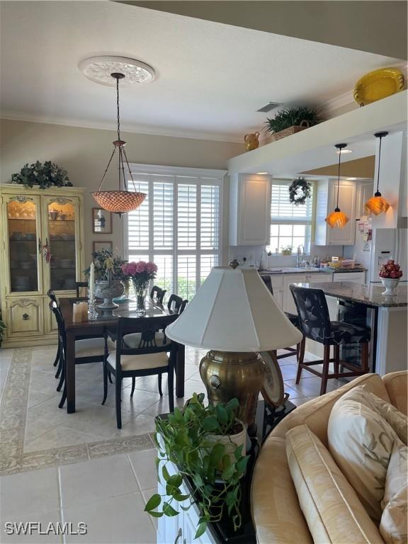 tiled dining area with ornamental molding