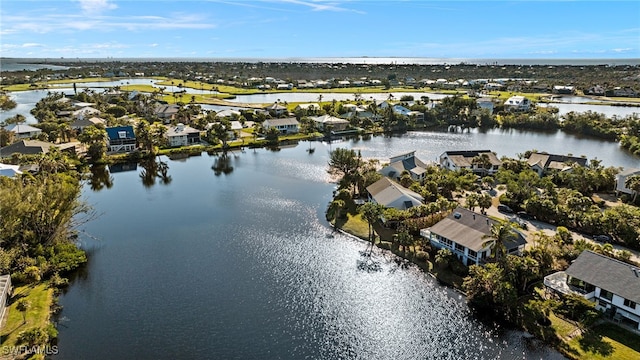 birds eye view of property with a residential view and a water view