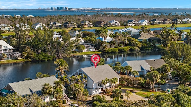 bird's eye view with a water view and a residential view