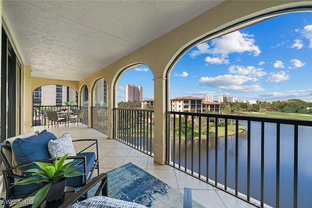 balcony featuring a water view