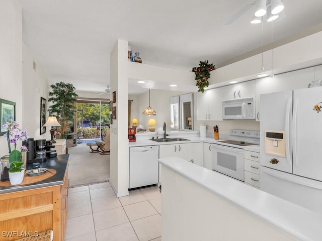 kitchen with sink, white appliances, ceiling fan, white cabinetry, and decorative light fixtures