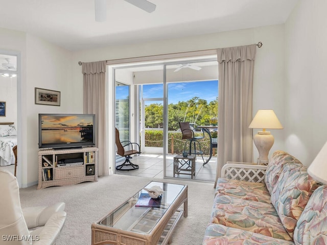 living room with light colored carpet and ceiling fan