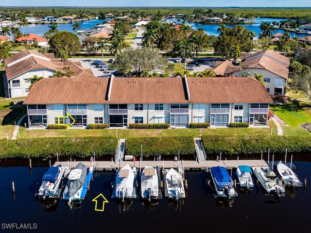 birds eye view of property with a water view