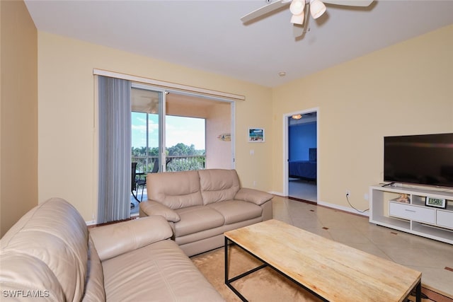 tiled living room featuring ceiling fan