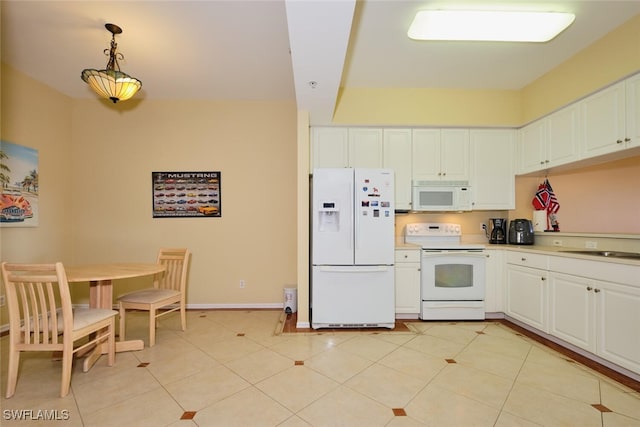 kitchen featuring light tile patterned flooring, white cabinets, white appliances, and decorative light fixtures