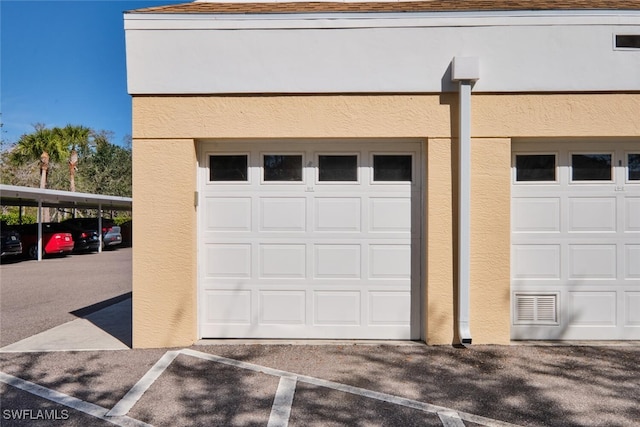 garage with a carport