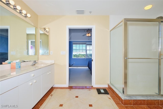 bathroom with vanity, tile patterned floors, and walk in shower