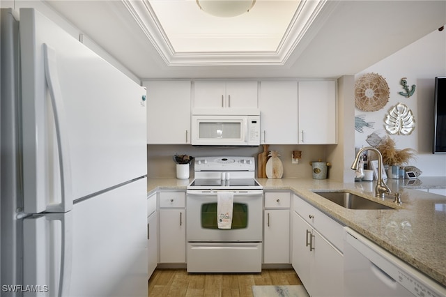 kitchen featuring white cabinetry, white appliances, crown molding, and sink