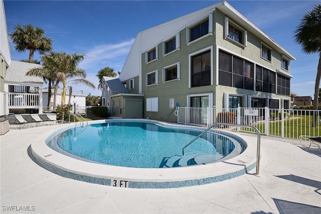 view of swimming pool with a patio area