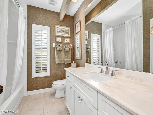 full bathroom featuring vanity, toilet, tile patterned floors, beam ceiling, and shower / bath combo with shower curtain