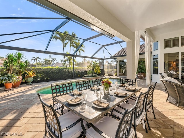 view of patio / terrace with a lanai