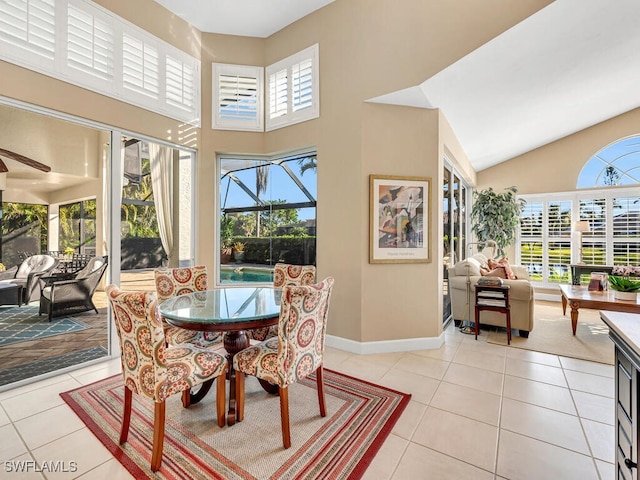 28880 Trenton Ct, Bonita Springs, FL 34134 - dining area featuring light tile patterned floors, a high ceiling, and baseboards