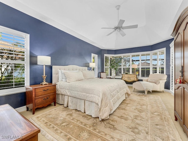 carpeted bedroom featuring ceiling fan