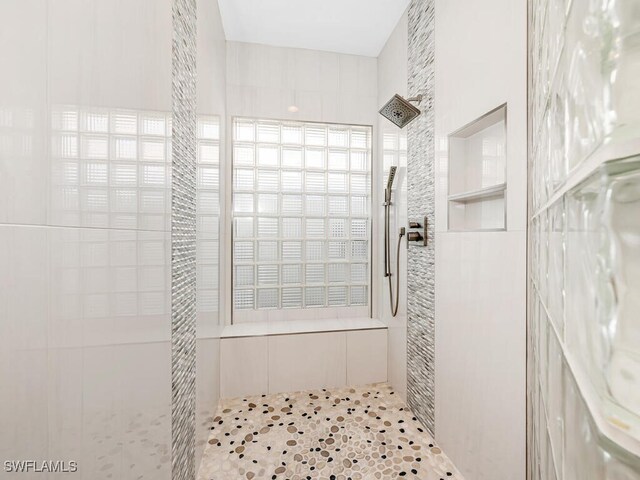 bathroom with tiled shower