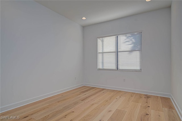 unfurnished room with light hardwood / wood-style flooring