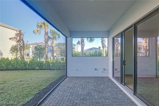 unfurnished sunroom with a wealth of natural light