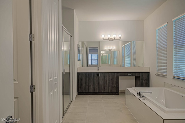 bathroom featuring tile patterned floors, vanity, and independent shower and bath