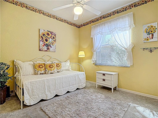 bedroom with ceiling fan and carpet flooring