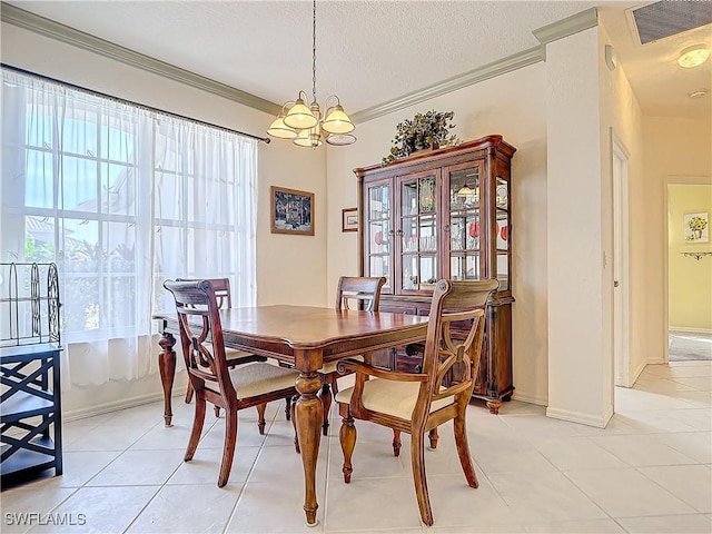 dining space with crown molding, a chandelier, a textured ceiling, and light tile patterned flooring