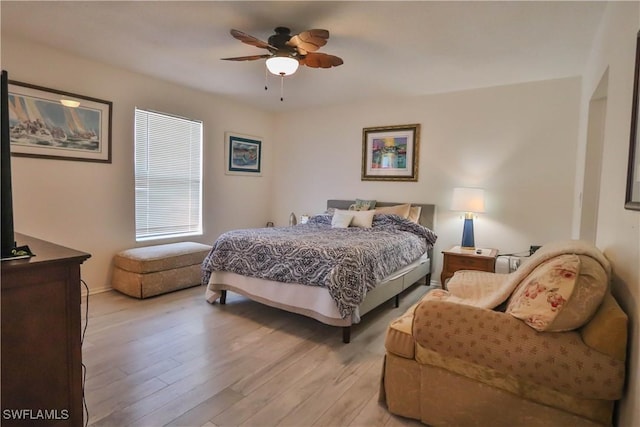 bedroom featuring ceiling fan and light hardwood / wood-style flooring