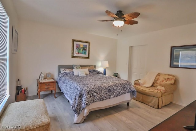 bedroom with wood-type flooring and ceiling fan