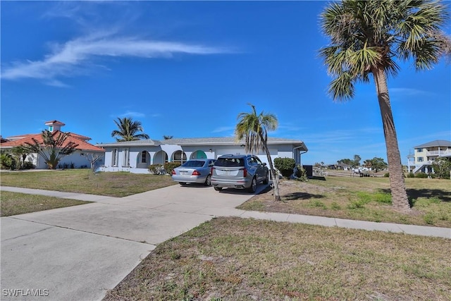 ranch-style home with a front yard