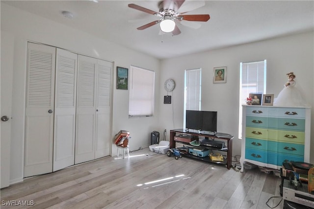 interior space with ceiling fan and light hardwood / wood-style flooring