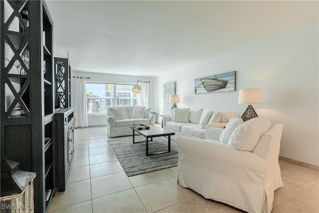 living room with light tile patterned flooring