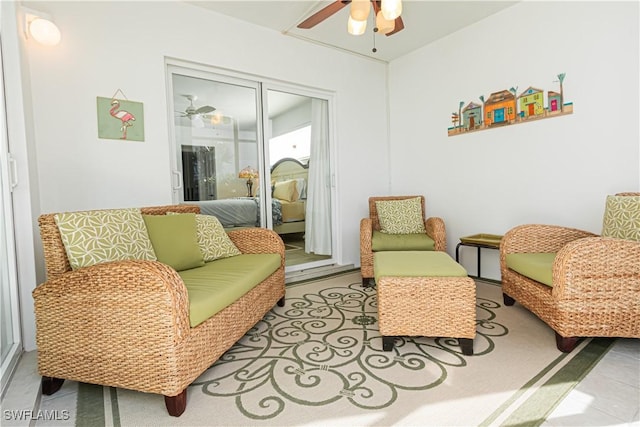 living area featuring ceiling fan