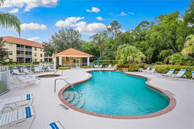 view of pool featuring a patio