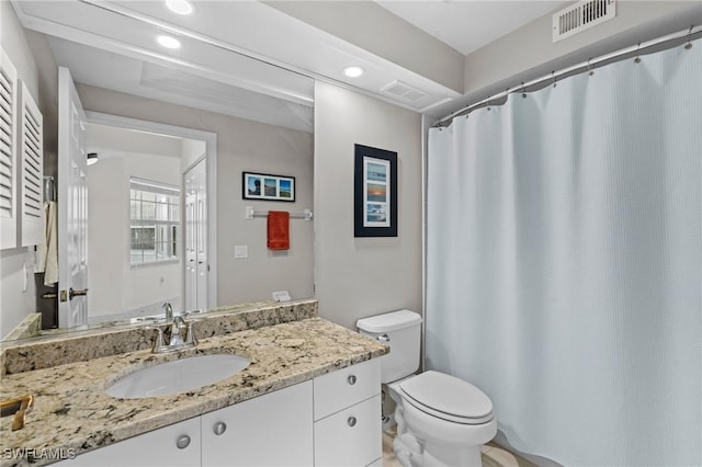 bathroom with vanity and toilet