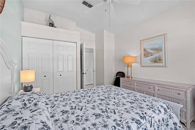 bedroom featuring ceiling fan, vaulted ceiling, and a closet